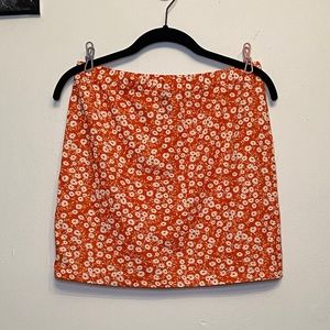 Orange flower pattern mini skirt